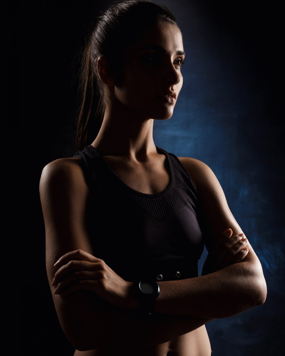 Athlete lit against a dark ground