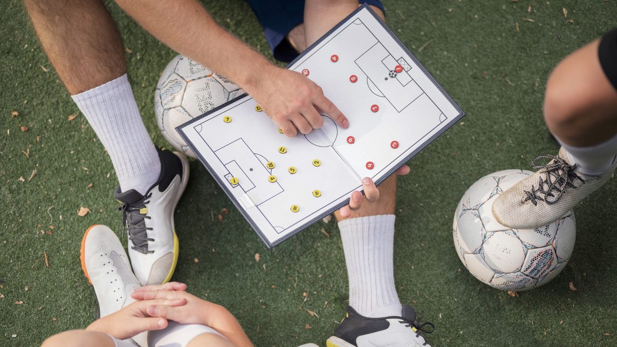 Coach with a tactics board